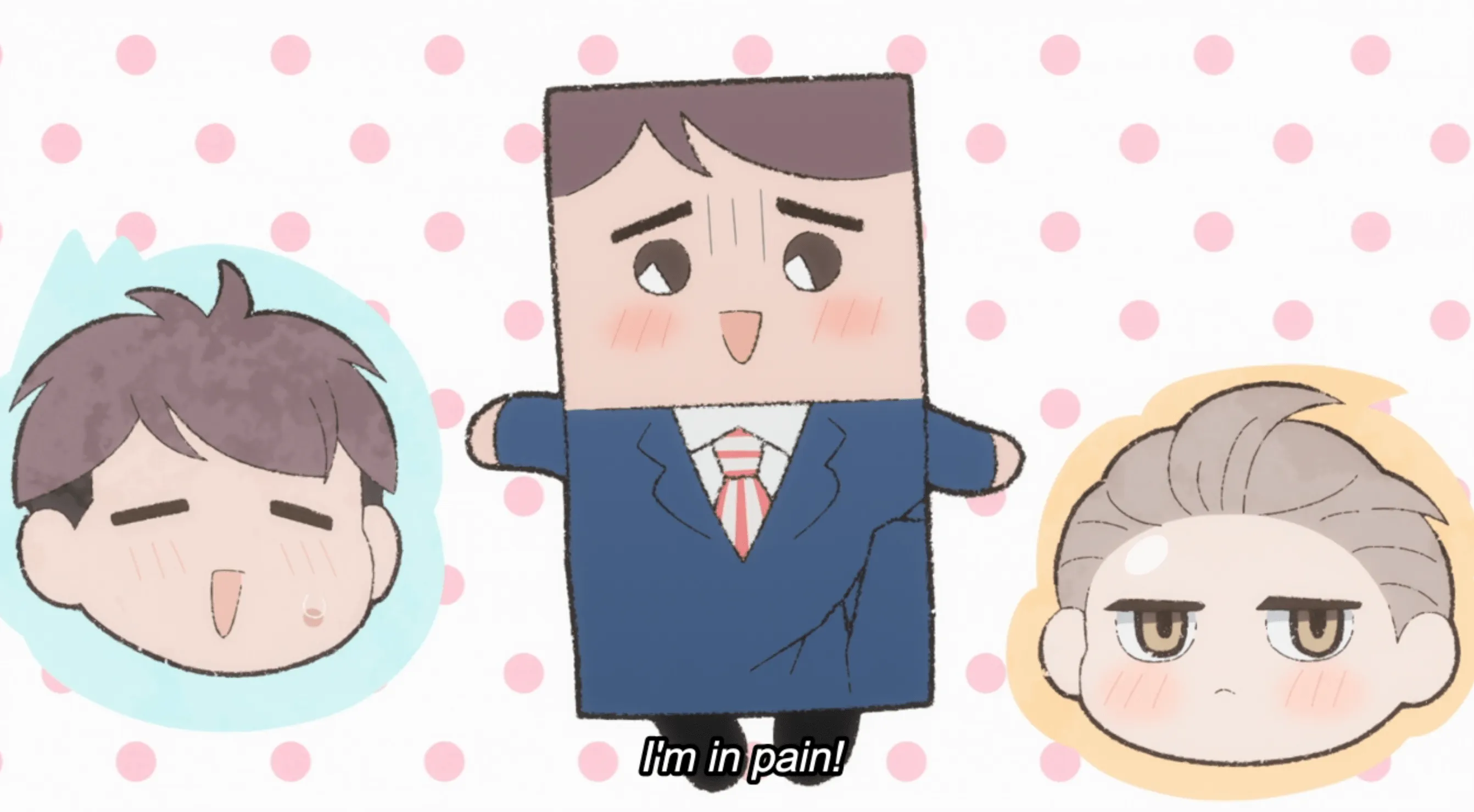 Chibis de los rostros de Momose y Shirosaki flotando junto a una caricatura rectangular de Momose.  El texto del subtítulo dice: ¡Me duele!