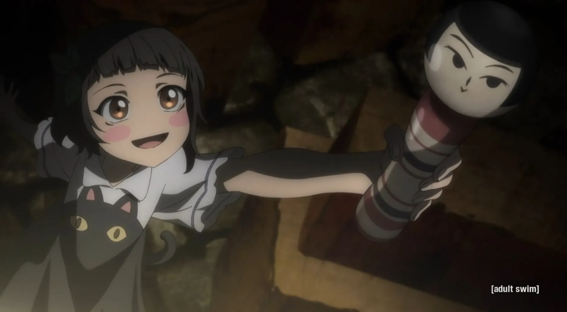 Kimi felizmente sosteniendo un objeto.