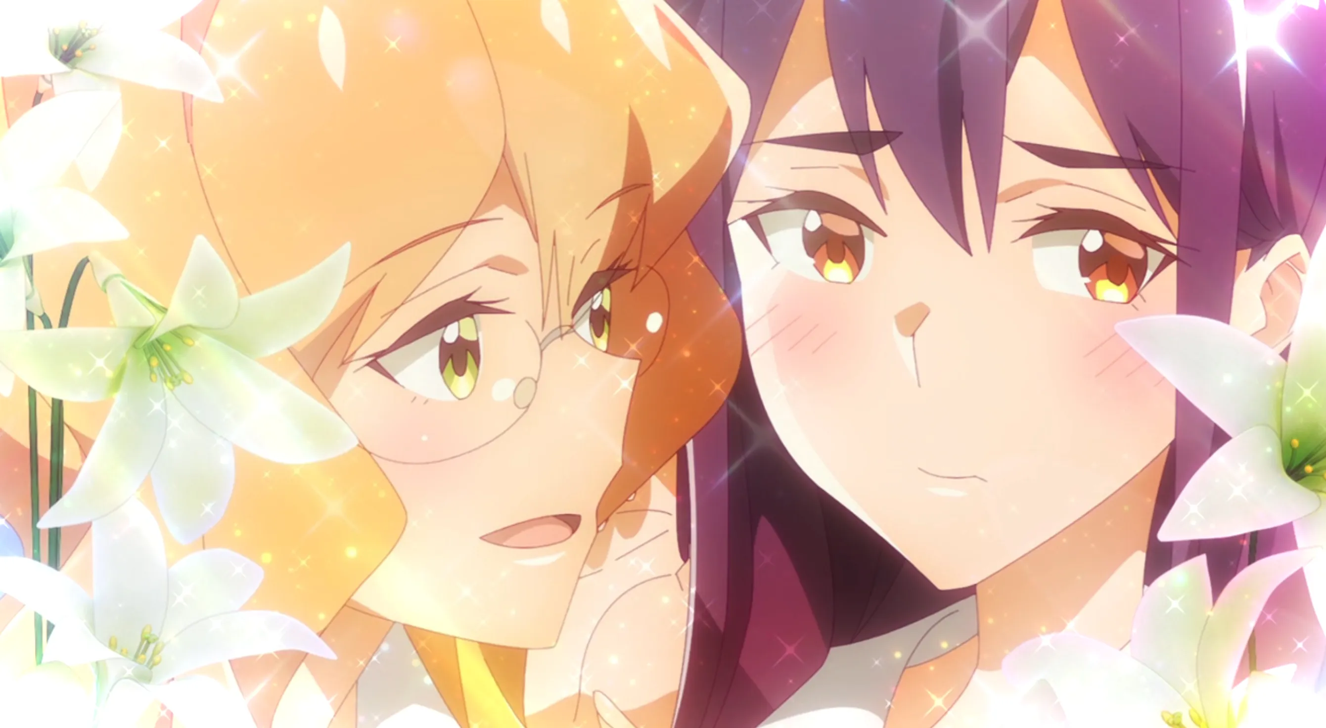 Primer plano de los rostros de Sumika y Mitsuki, muy cerca y rodeados por un borde de lirios brillantes.