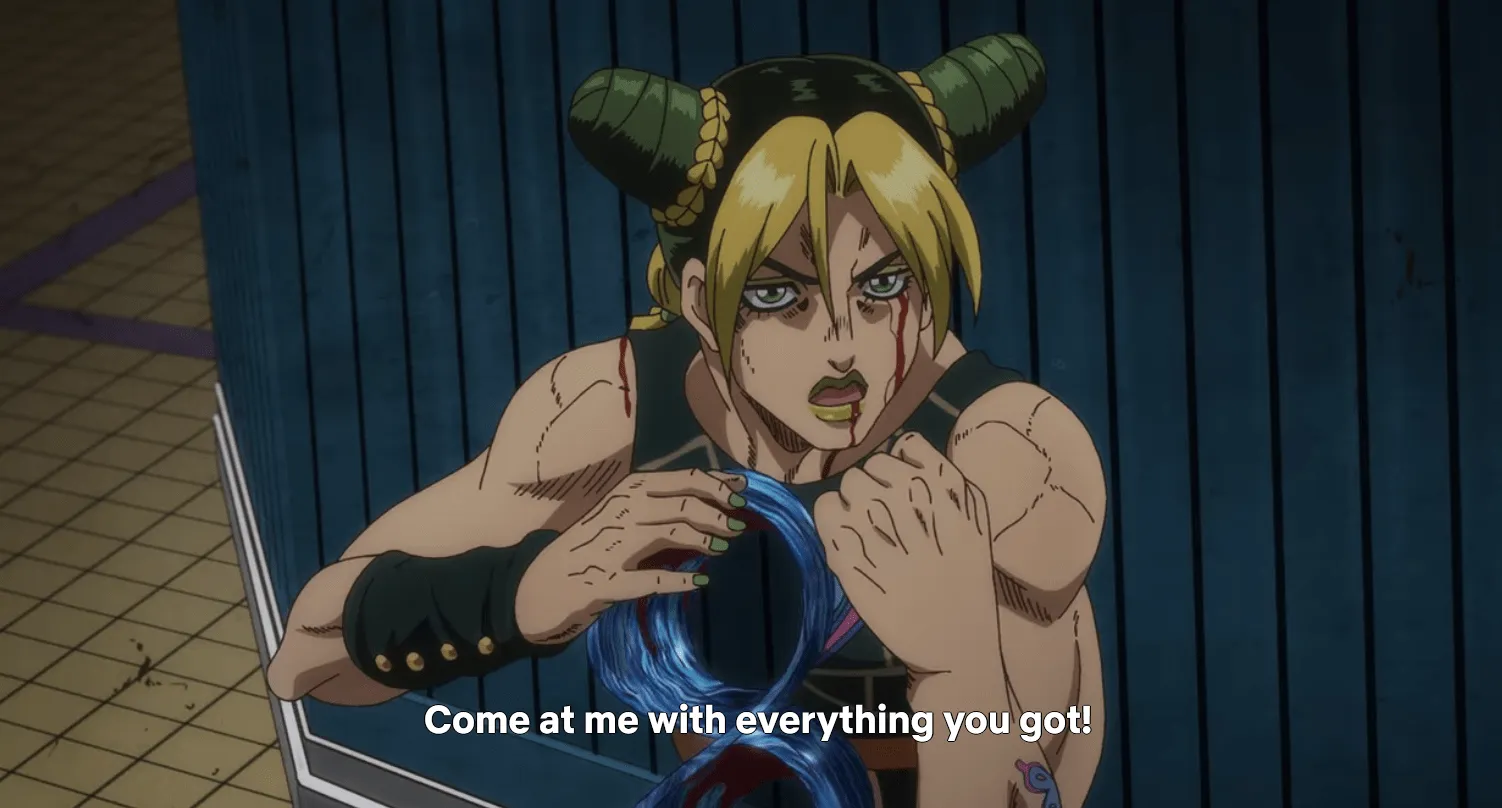 Jolyne en posición de lucha, su cuerpo convertido en una tira de Moebius.  Subtítulos: ¡Ven a mí con todo lo que tienes!