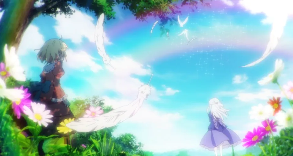 Anis mirando a Euphyllia con un arco iris en lo alto.